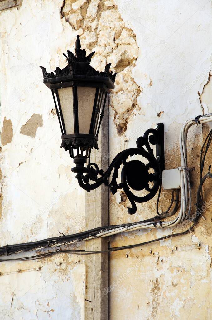 Wrought iron street lantern in the old town, Ronda, Malaga Province, Andalucia.