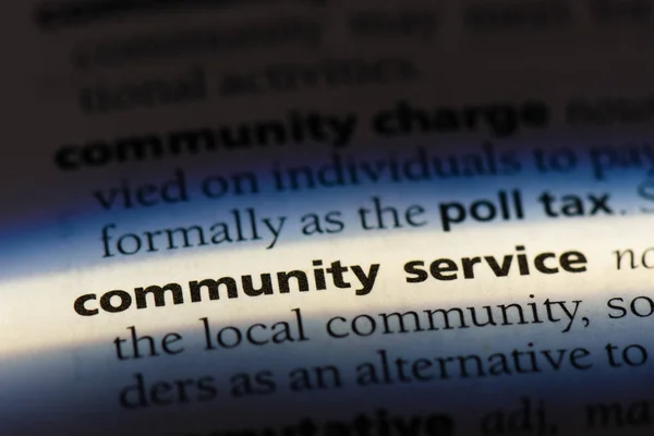 community service word in a dictionary. community service concept