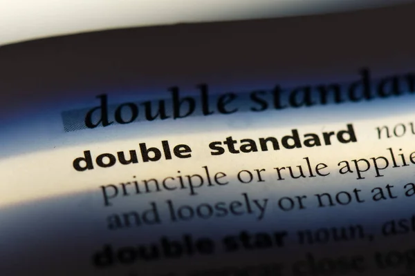 double standard word in a dictionary. double standard concept