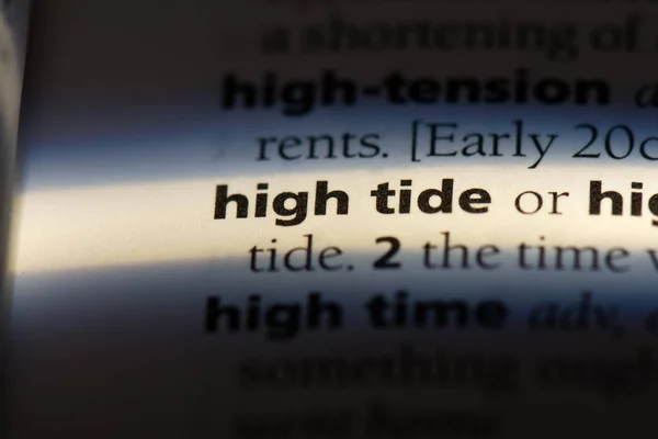 high tide word in a dictionary. high tide concept.