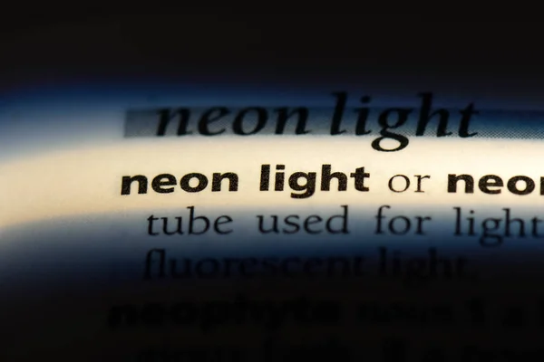 neon light word in a dictionary. neon light concept.