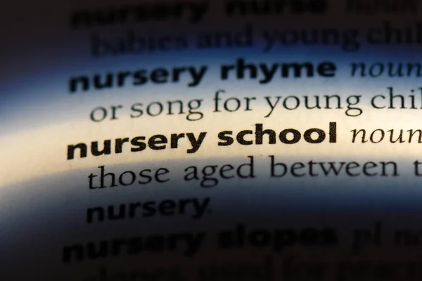 nursery school word in a dictionary. nursery school concept.