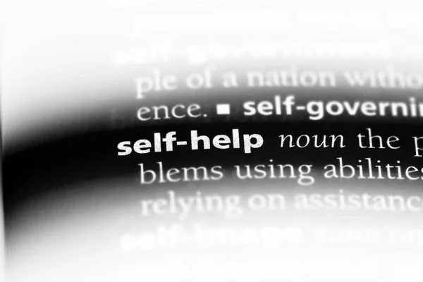 self help word in a dictionary. self help concept.