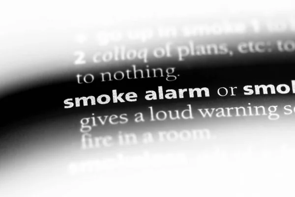 smoke alarm word in a dictionary. smoke alarm concept.