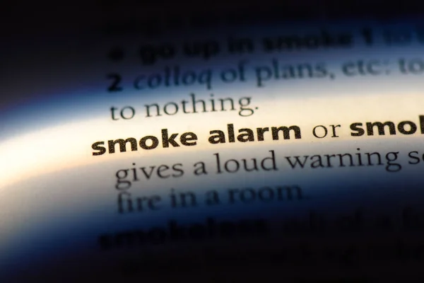 smoke alarm word in a dictionary. smoke alarm concept.