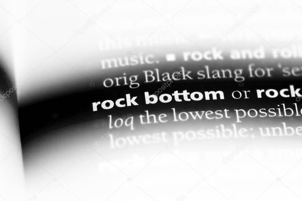 rock bottom word in a dictionary. rock bottom concept.