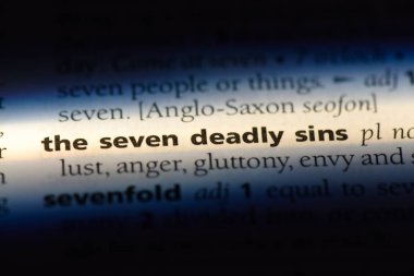 the seven deadly sins word in a dictionary. the seven deadly sins concept. clipart