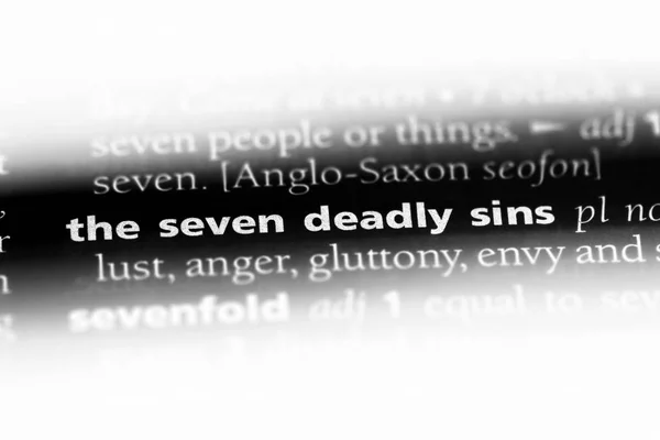 the seven deadly sins word in a dictionary. the seven deadly sins concept.