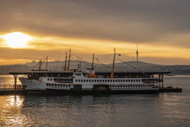 karakoy,istanbul,turkey- april 23,2019. sunrise and city lines ferry at karakoy pier for passenger transport  in istanbul