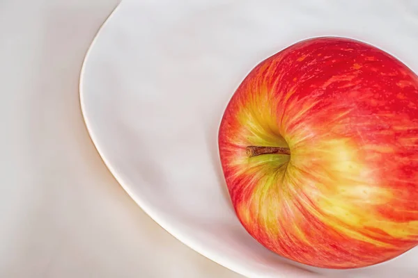 red apples on a white plate