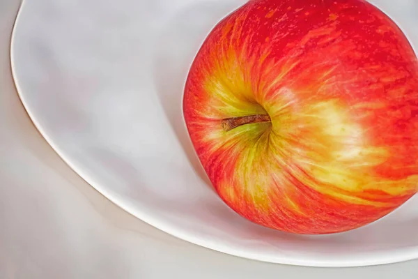 red apples on a white plate