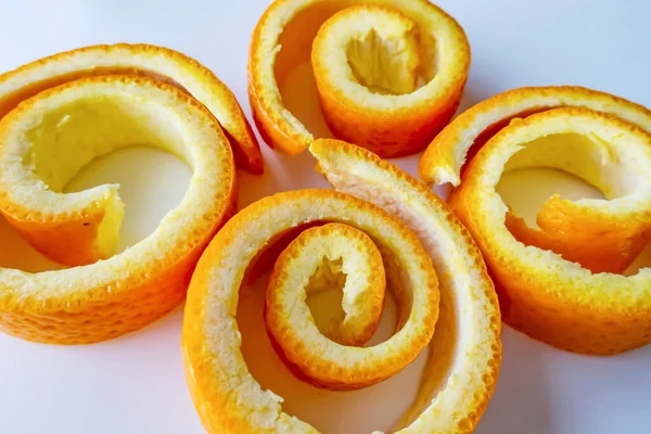 decorative orange peels on white plate