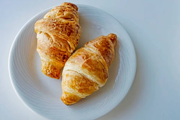 France\'s national food croissant on a white plate
