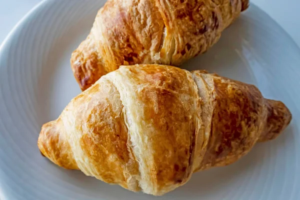 France\'s national food croissant on a white plate