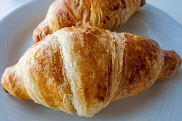 France\'s national food croissant on a white plate