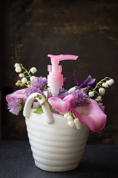 Feminine  hygiene soap with flowers .Dark background.Woman health  concept