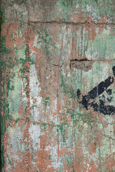 Green brown paint on wooden plank or fence