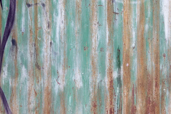 Green brown paint on wooden plank or fence
