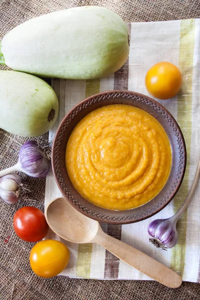 Squash caviar with garlic and tomatoes in a rustic bowl