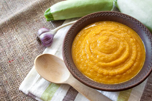 Squash caviar with garlic and tomatoes in a rustic bowl