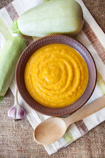 Squash caviar with garlic and tomatoes in a rustic bowl