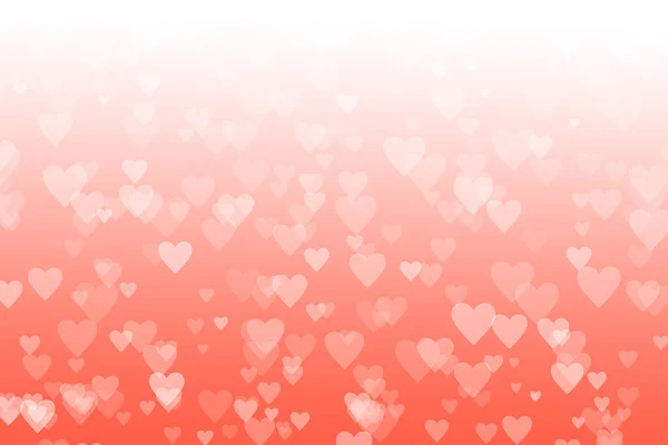 Blurred heart shaped bokeh on pastel coral gradient background. Valentine\'s day and love concept