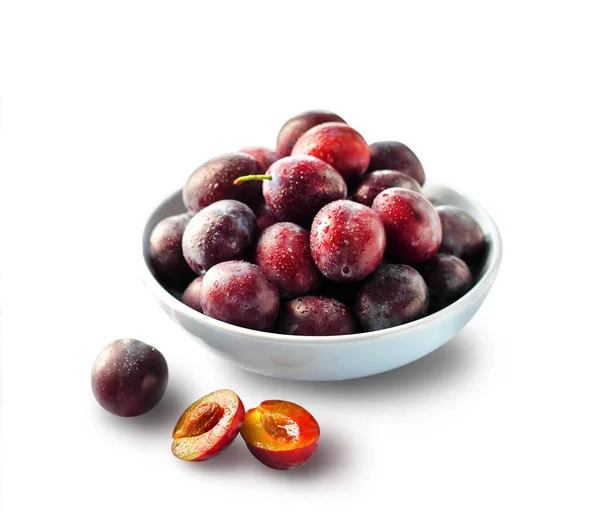 Fresh plums in a bowl isolated — Stock Photo, Image