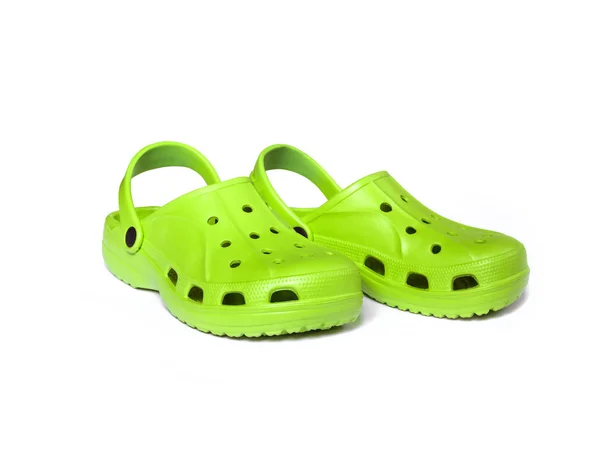 Bright green clogs diisolasi pada latar belakang putih — Stok Foto