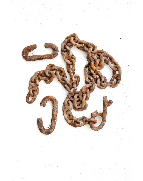 Old rusty c-shaped scrapers and chain on white background — Stock Photo, Image