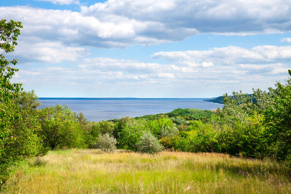 Beautiful landscape of Kaniv Reservoir, Ukraine, in sunny day with bright cloudy sky