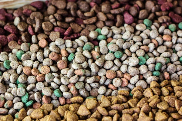 Dry pet food background - three kinds. Meat.