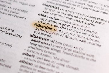 The word or phrase Albanian in a dictionary highlighted with marker.