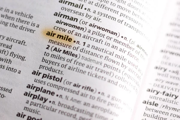 The word or phrase Air Mile in a dictionary highlighted with marker.