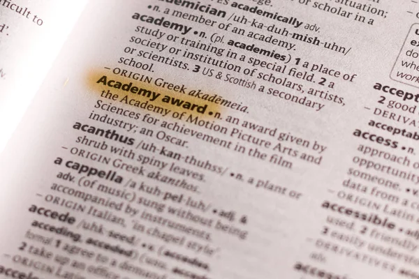 The word or phrase Academy Award in a dictionary highlighted with marker.