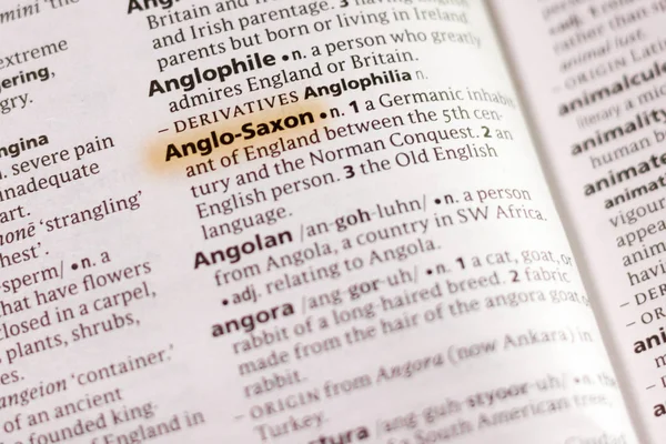 The word or phrase Anglo-Saxon in a dictionary highlighted with marker.