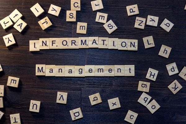 information management word made with scrabble letters.