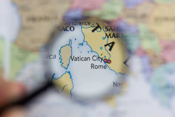 Vatican City on the map of the world or atlas.