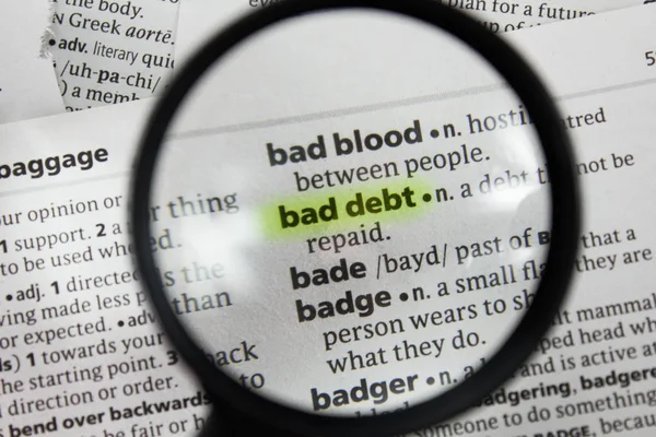 The word or phrase bad debt in a dictionary.