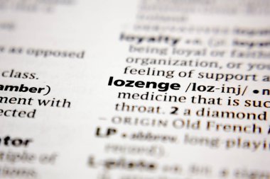 Word or phrase lozenge in a dictionary.