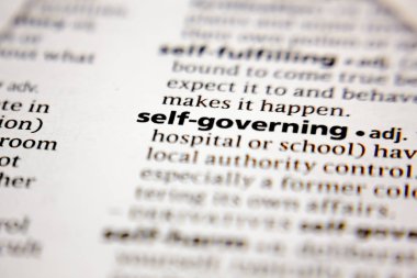 Word or phrase self-governing in a dictionary.