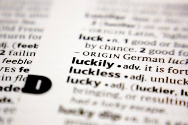 Word or phrase luckily in a dictionary.