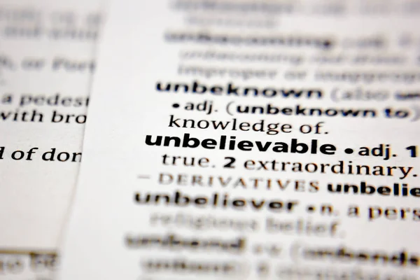 Word or phrase unbelievable in a dictionary. — Stock Photo, Image