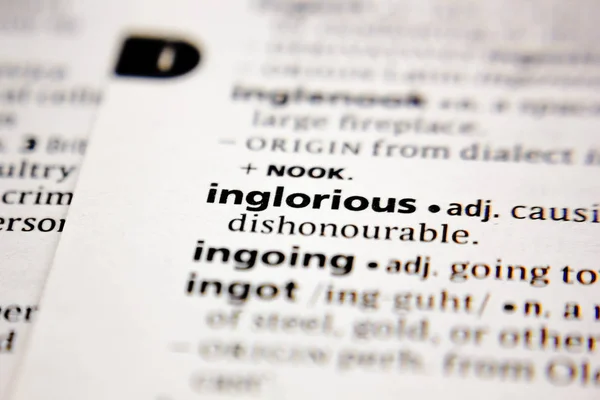 Word or phrase inglorious in a dictionary. — Stok fotoğraf