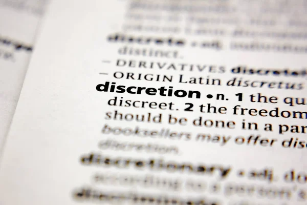 Word or phrase discretion in a dictionary. — Stock Photo, Image