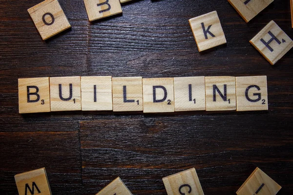 Word or phrase Building made with scrabble letters. — Stock Photo, Image