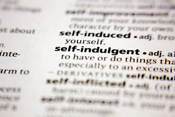 Word or phrase self-indulgent in a dictionary. — Stock Photo, Image