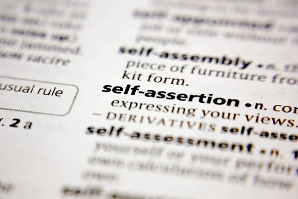 Word or phrase self-assertion in a dictionary. — Stock Photo, Image