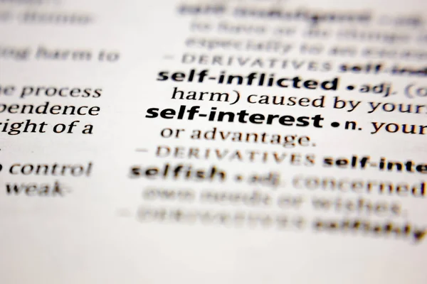 Word or phrase self-interest in a dictionary. — Stock Photo, Image