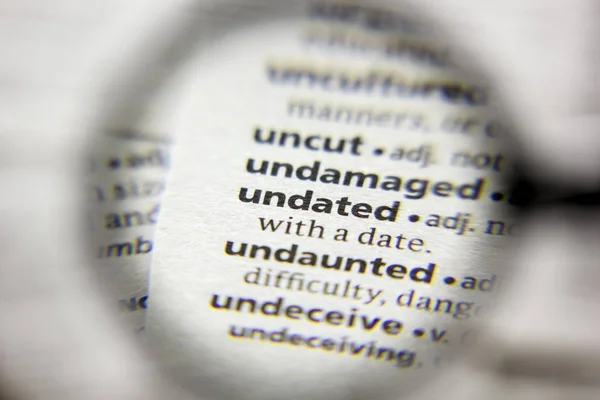 The word or phrase Undated in a dictionary. — Stock Photo, Image