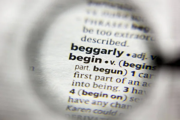 The word or phrase Begin in a dictionary. — Stock Photo, Image